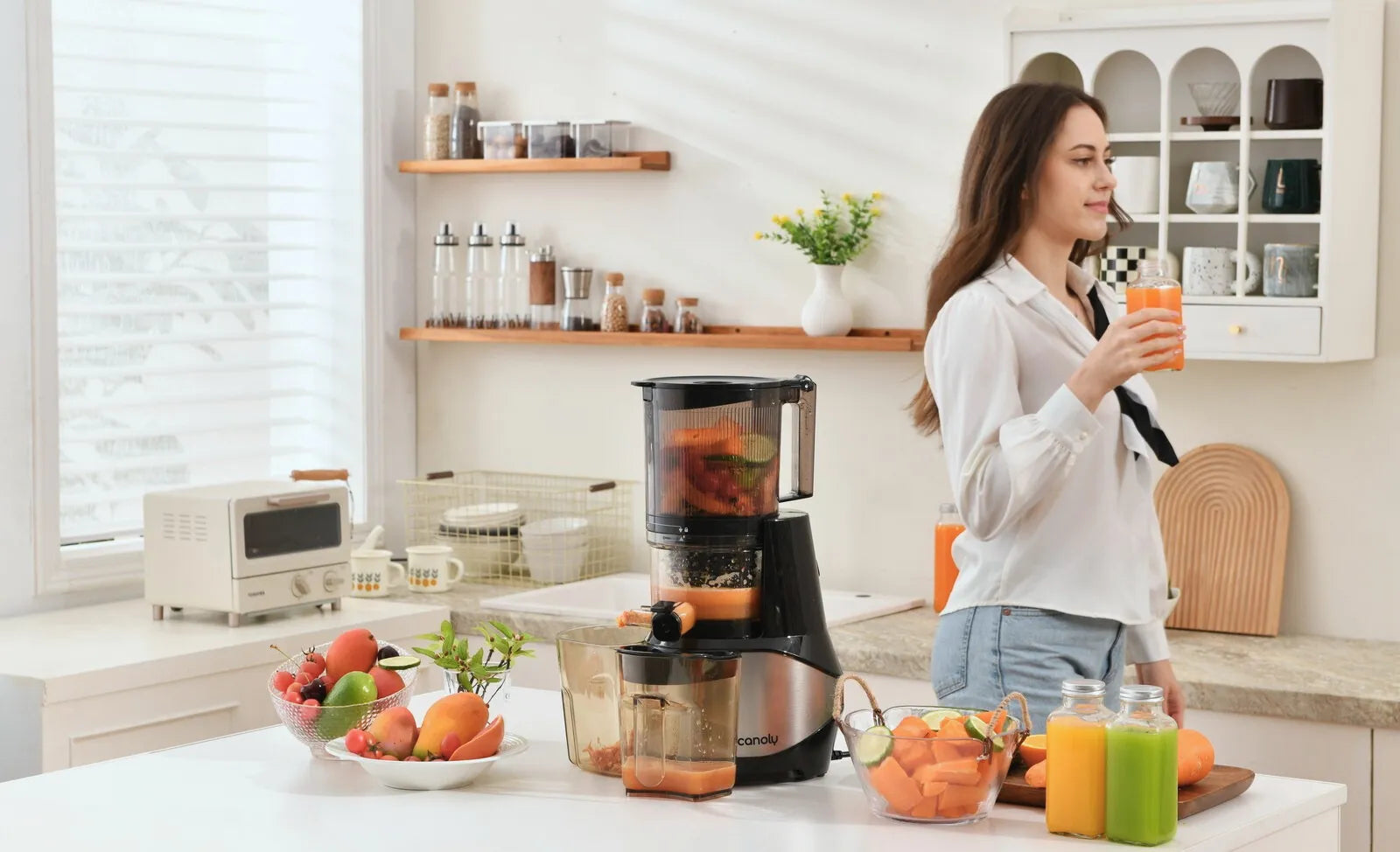 In a brightly lit kitchen, a girl is enjoying a glass of freshly squeezed juice from a anoly C09 Cold Press Slow Juicer  Extractor.